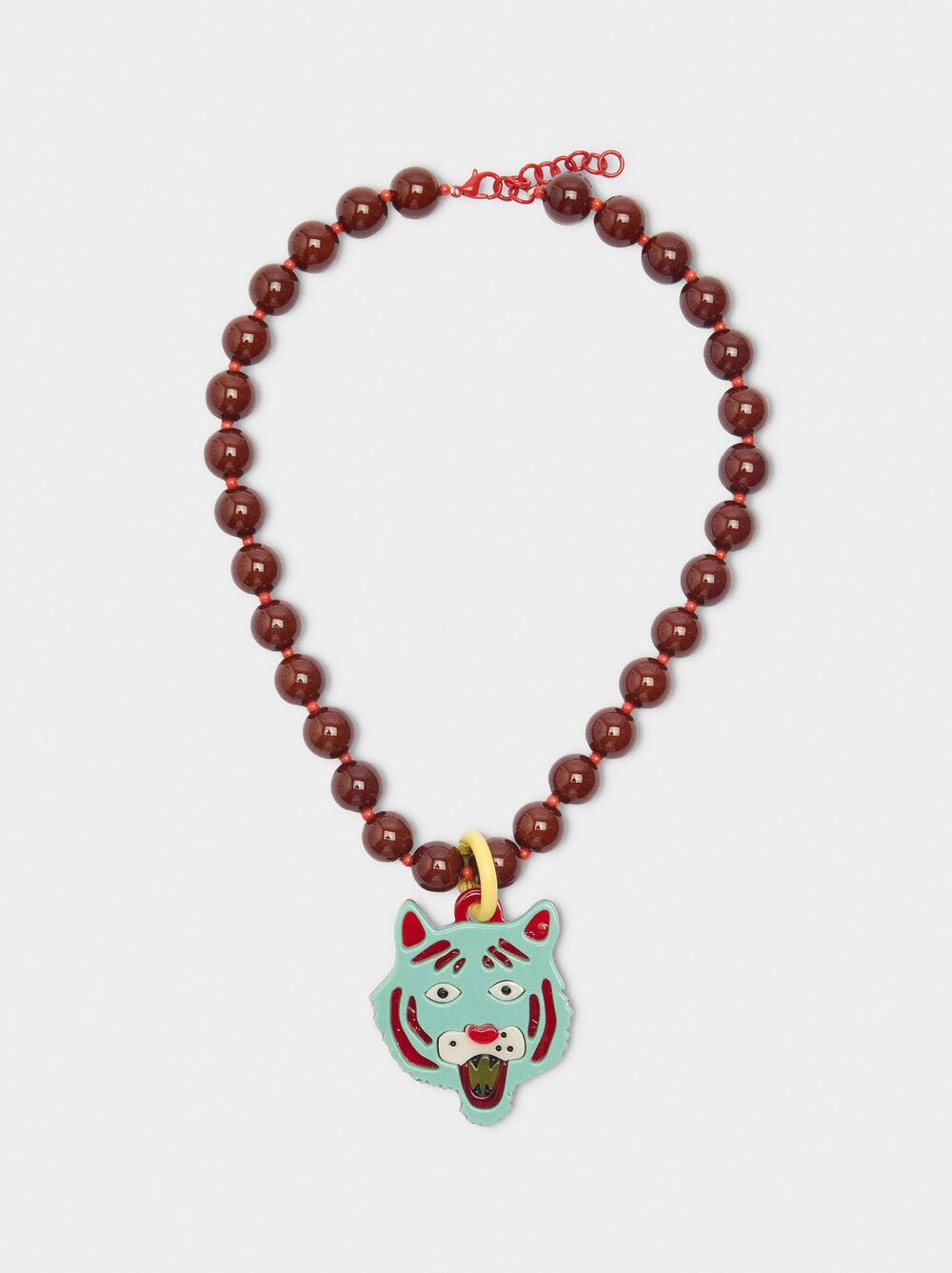 Necklace of beads with tiger pendant