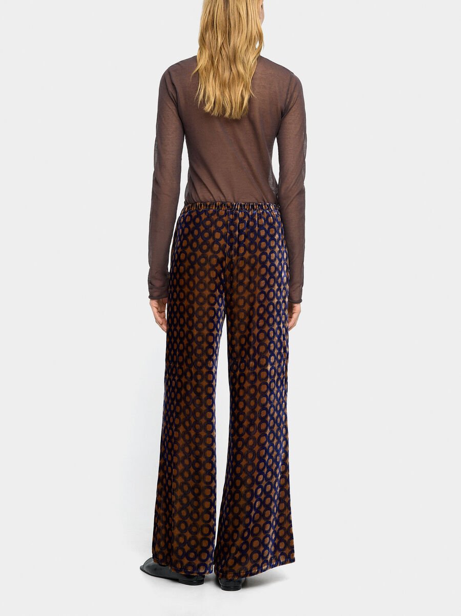 Velvet trousers with printed circles