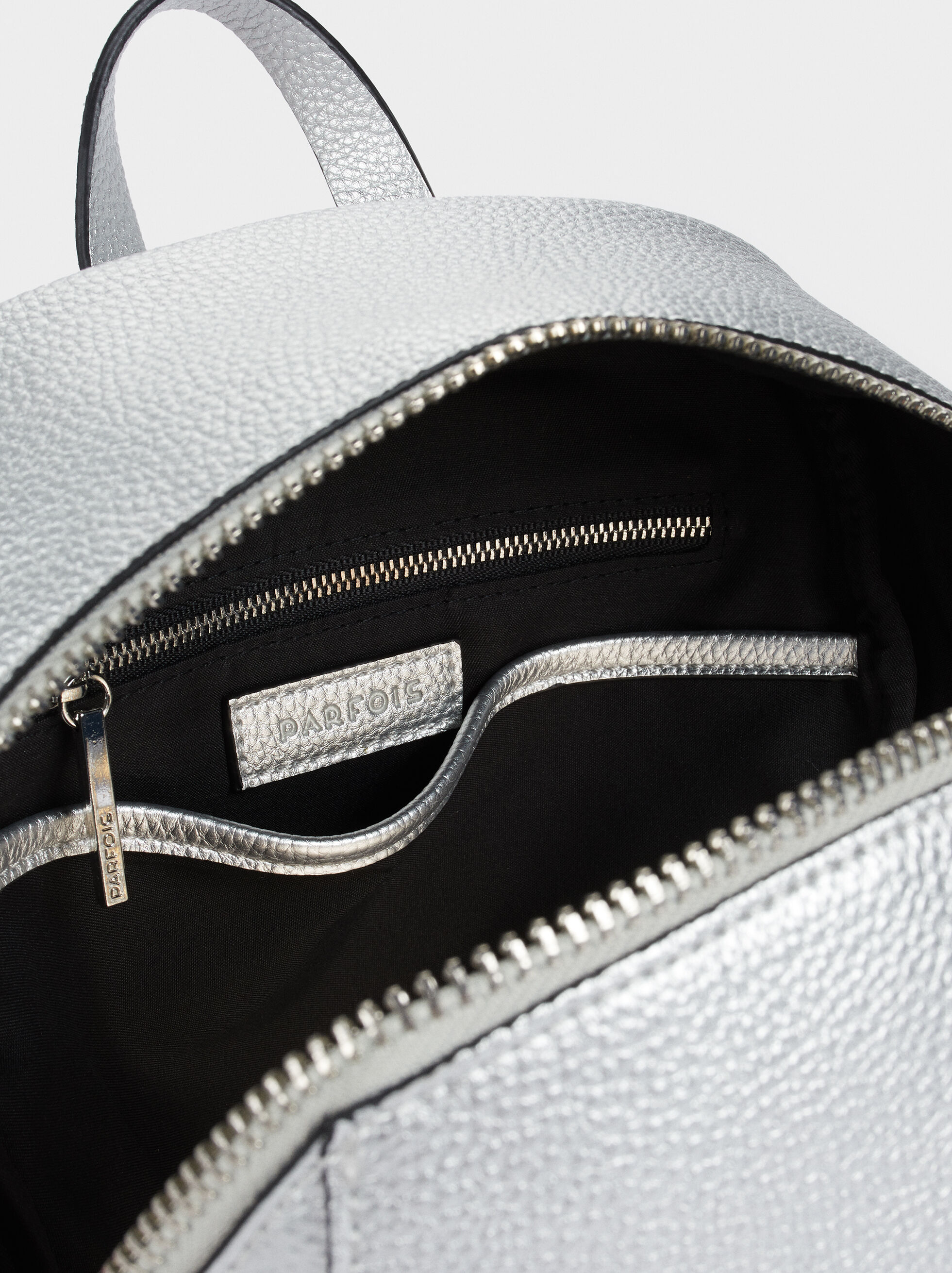 black backpack with silver zippers