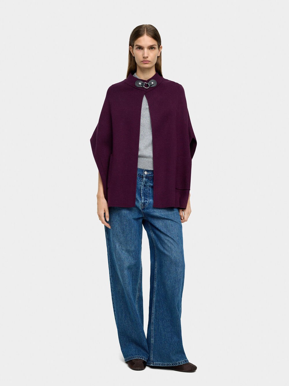 Knit poncho with high neck