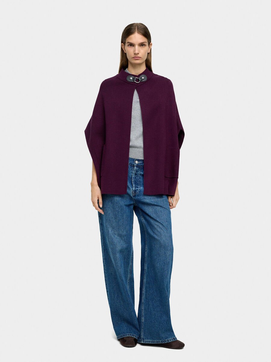 Knit poncho with high neck