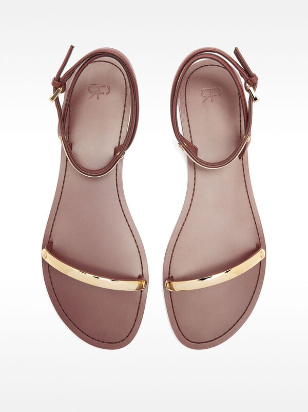 Flat sandals with metallic details