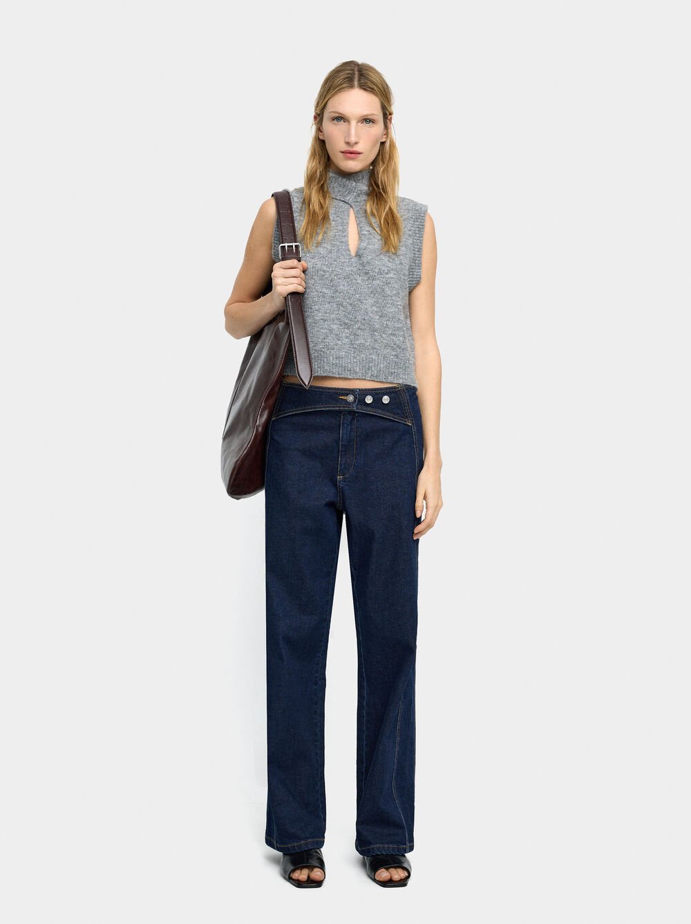 Denim trousers with overlap closure