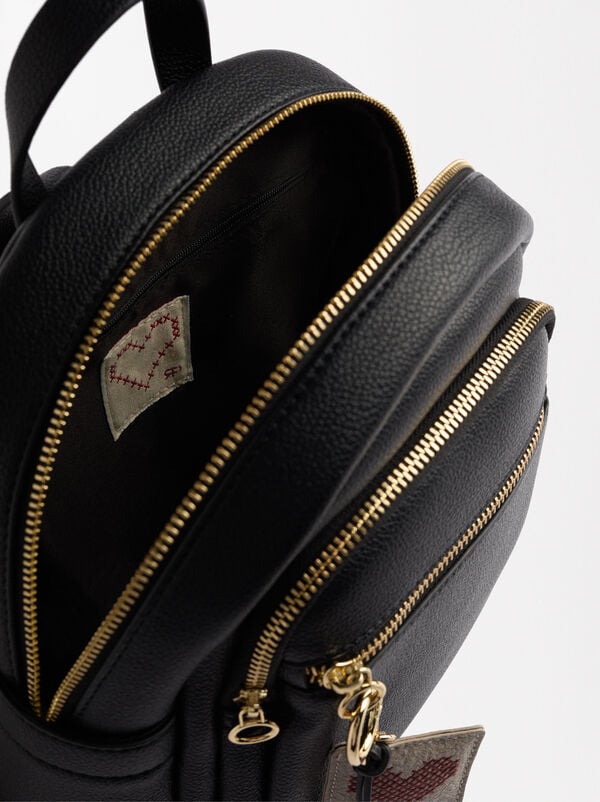 Backpack with heart pendant