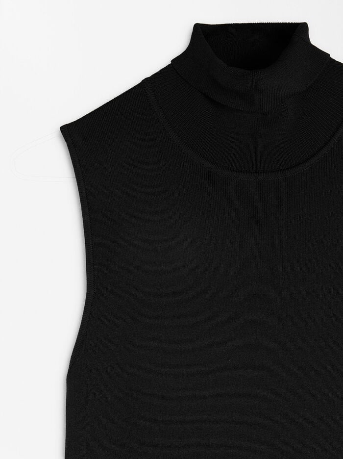 Mono de punto con cuello alto