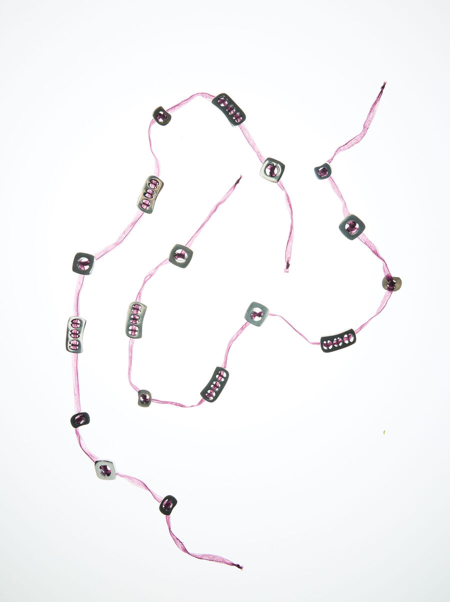 Cord bracelet with plates