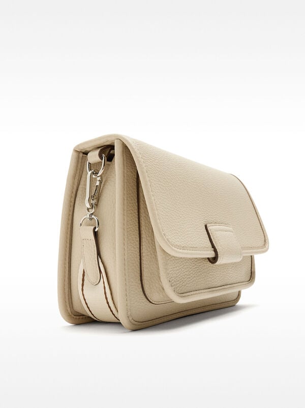 Crossbody bag with texture and flap closure