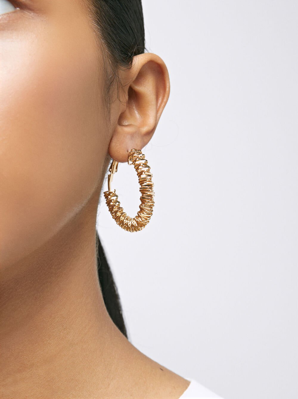 Golden irregular hoop earrings
