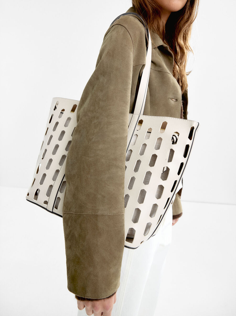 Perforated shopper bag with removable pouch