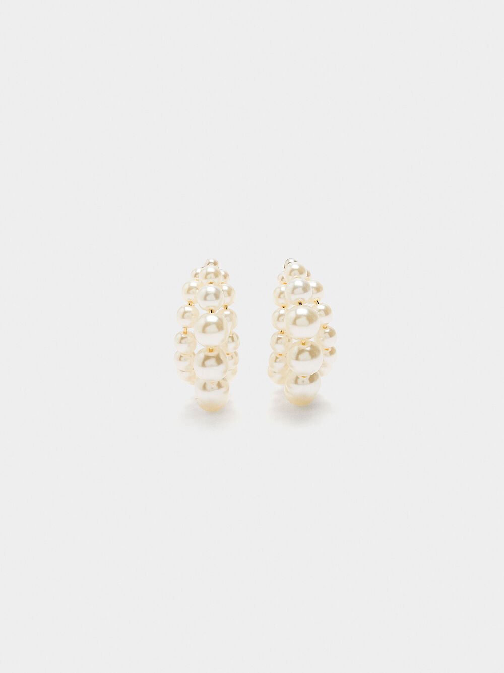 Open hoop earrings with pearls