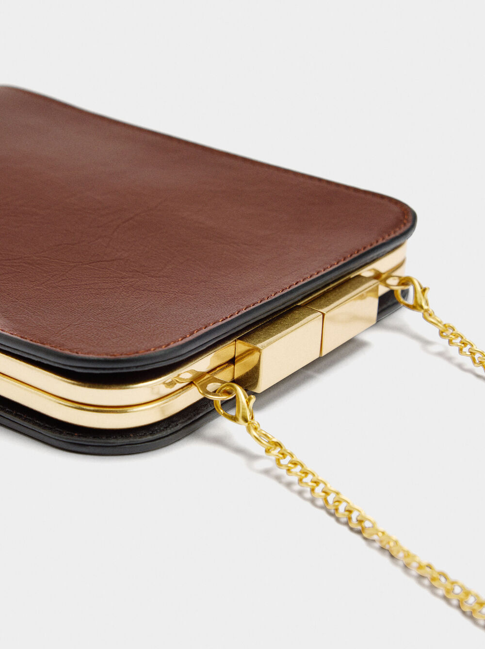 Clutch with leather party finish