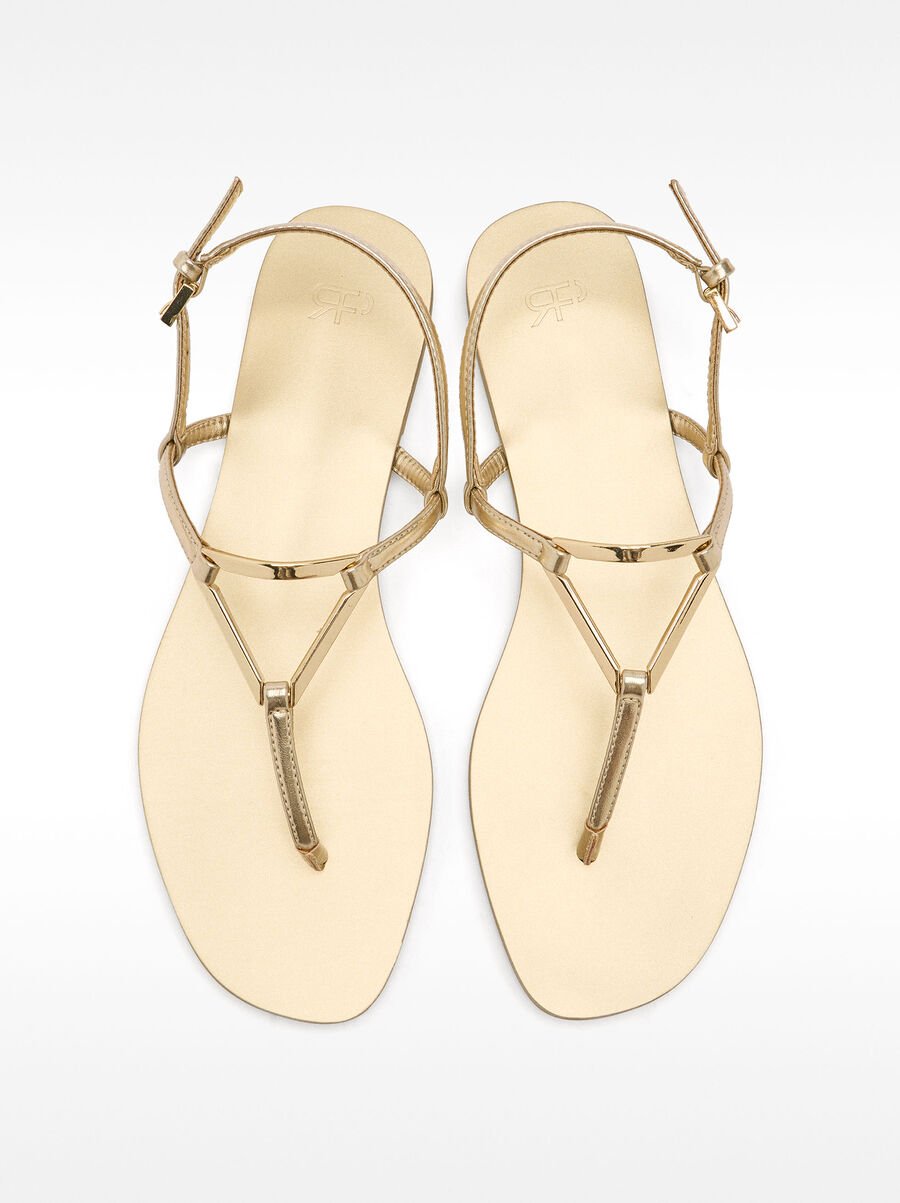 Flat sandals with metallic detail straps