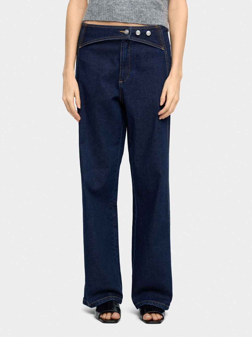 Denim trousers with overlap closure