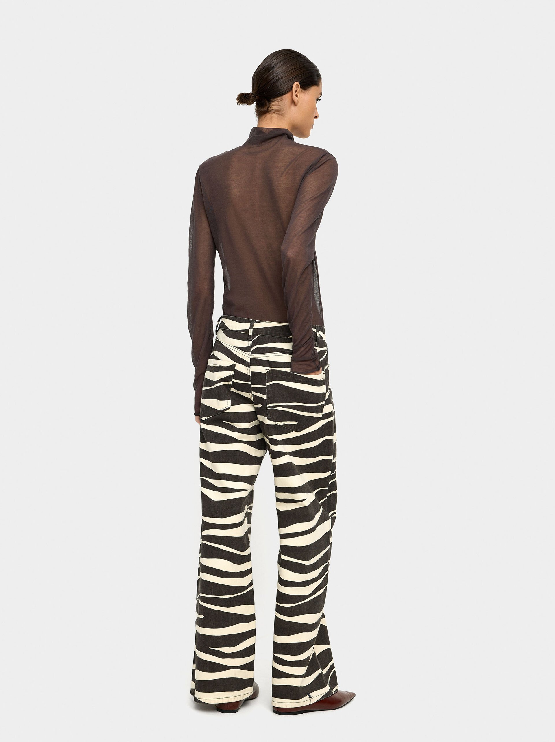 Denim printed trousers with animal print image number 3.0
