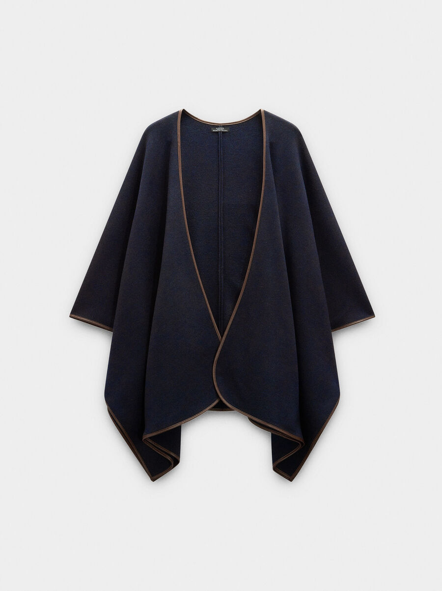 Knitted poncho with stitching detail