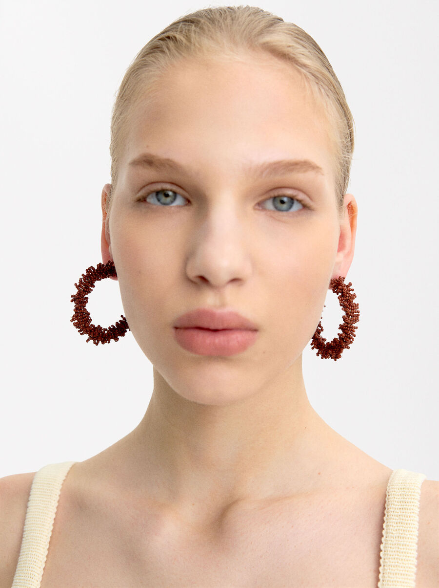 Open hoop earrings with beads