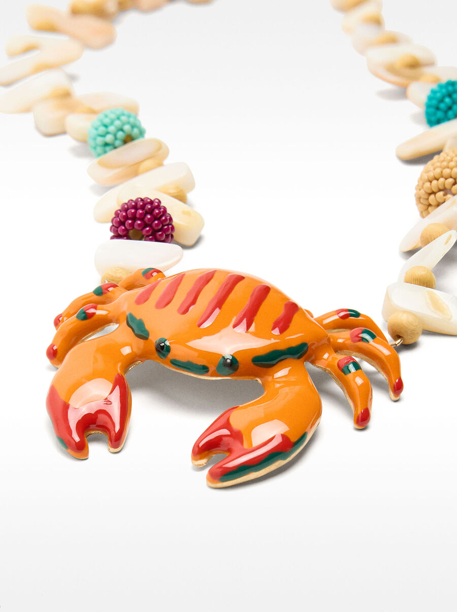 Short necklace with crab shell pendant