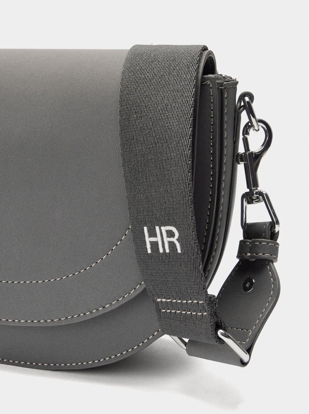 Oval crossbody bag with flap