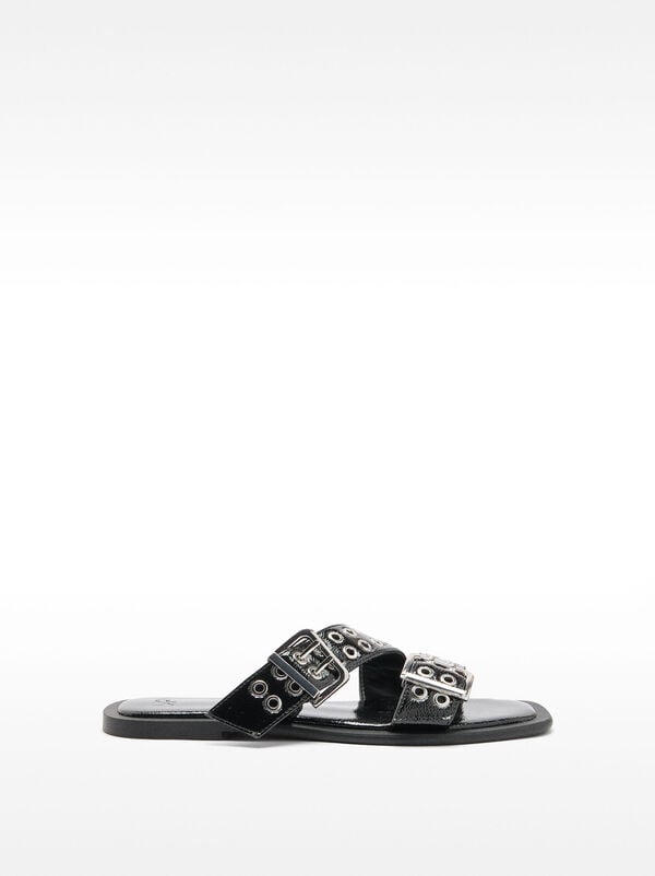 Flat sandals with buckles and studs