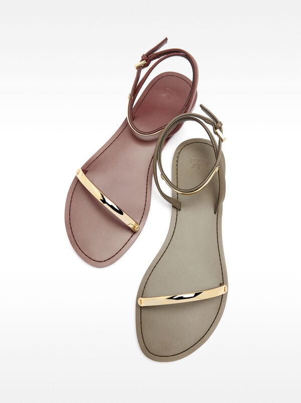 Flat sandals with metallic details