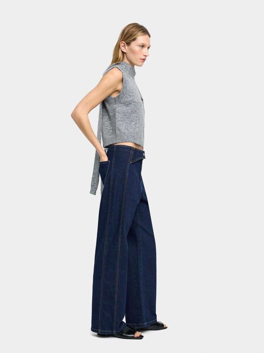 Denim trousers with overlap closure