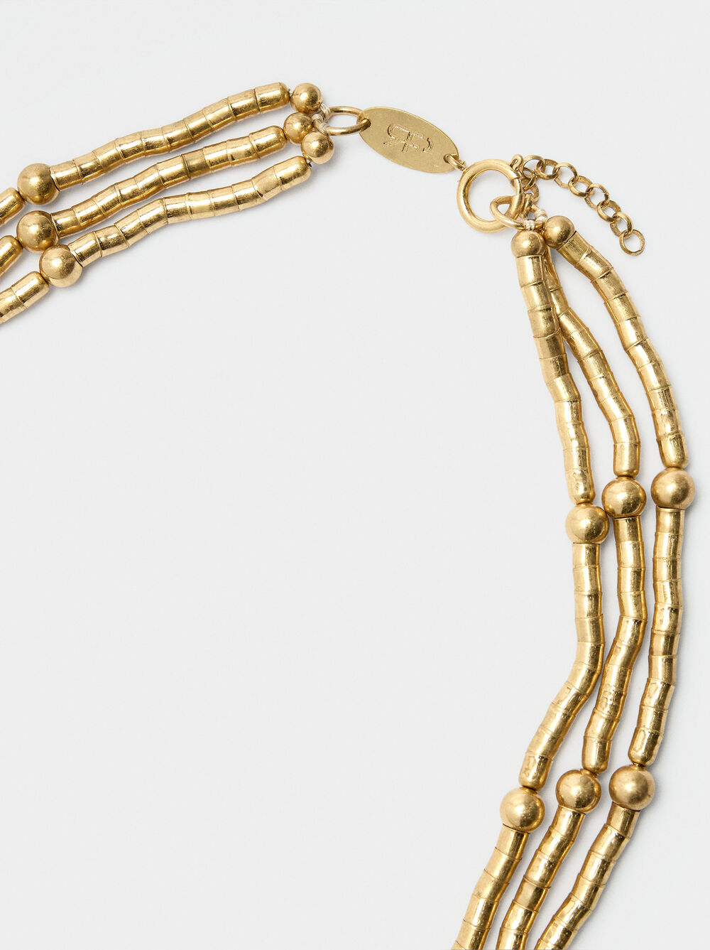 Flexible necklace with beads