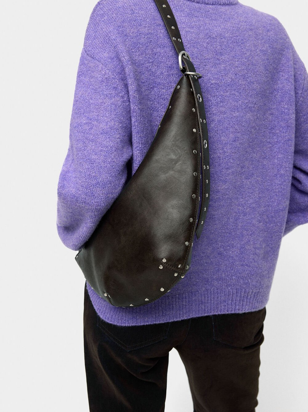 Asymmetric shoulder bag with studs