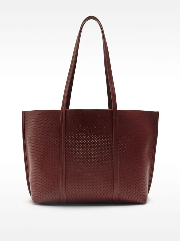 Perforated shopper bag with removable pouch