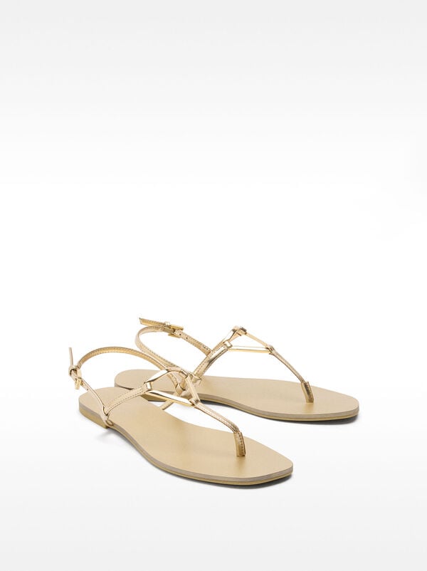Flat sandals with metallic detail straps
