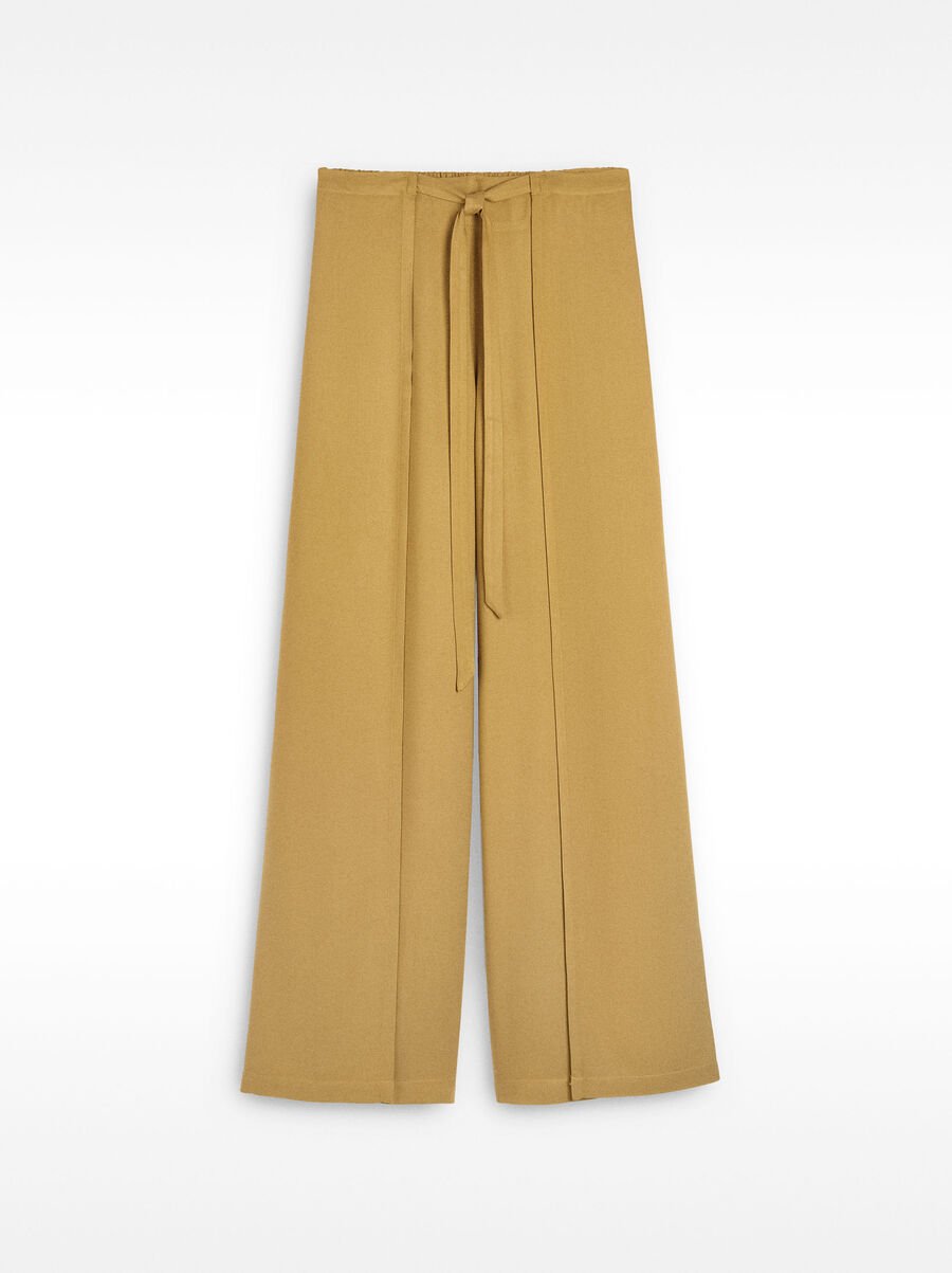 Fluid trousers with side overlaps