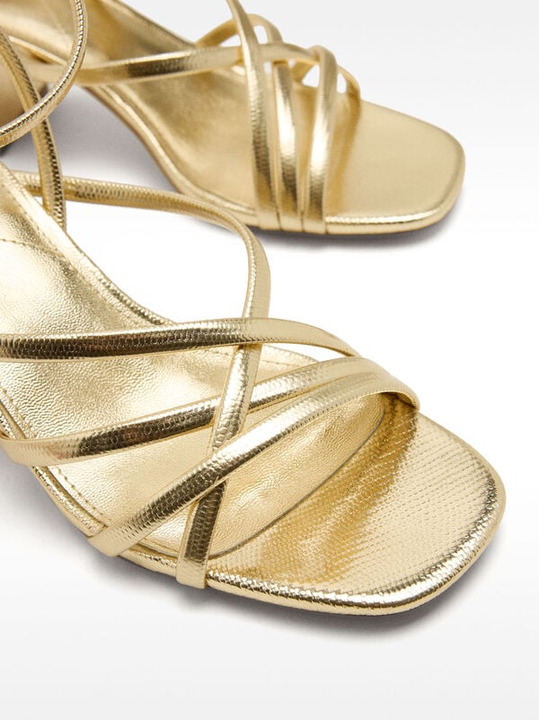 Metallic heeled sandals with crossed straps
