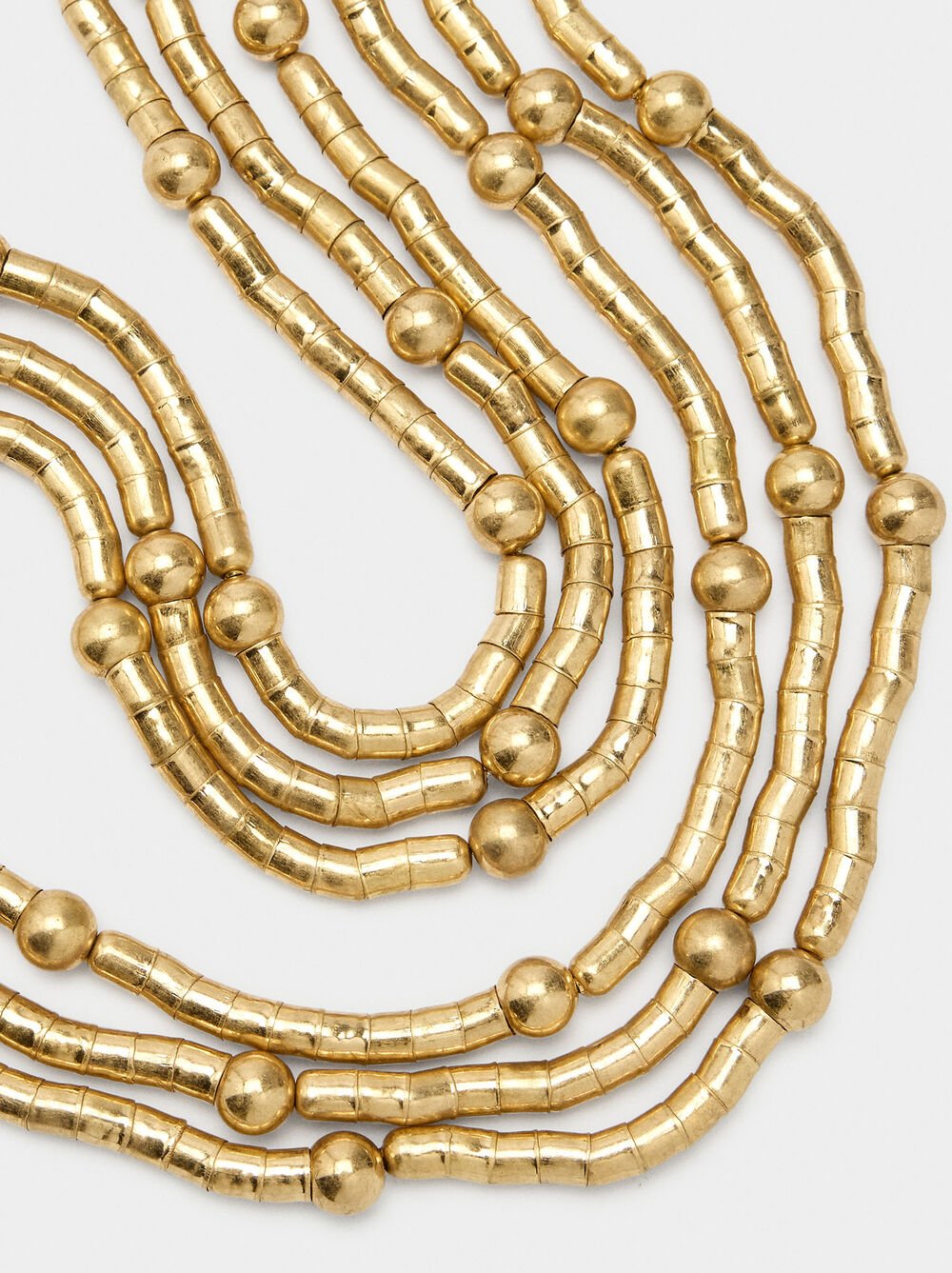 Flexible necklace with beads