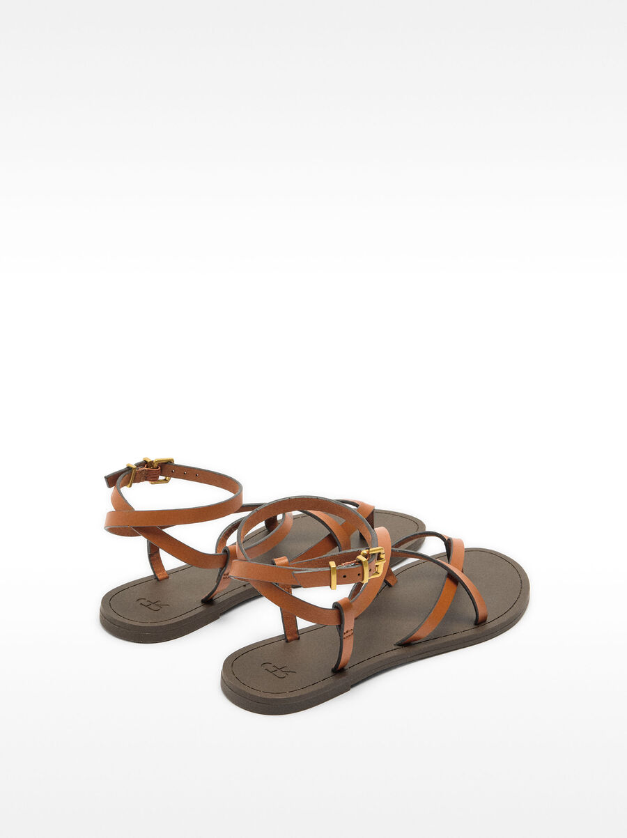 Leather sandals with crossed straps