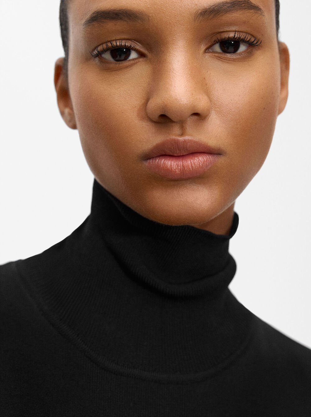 Knit jumpsuit with high neck