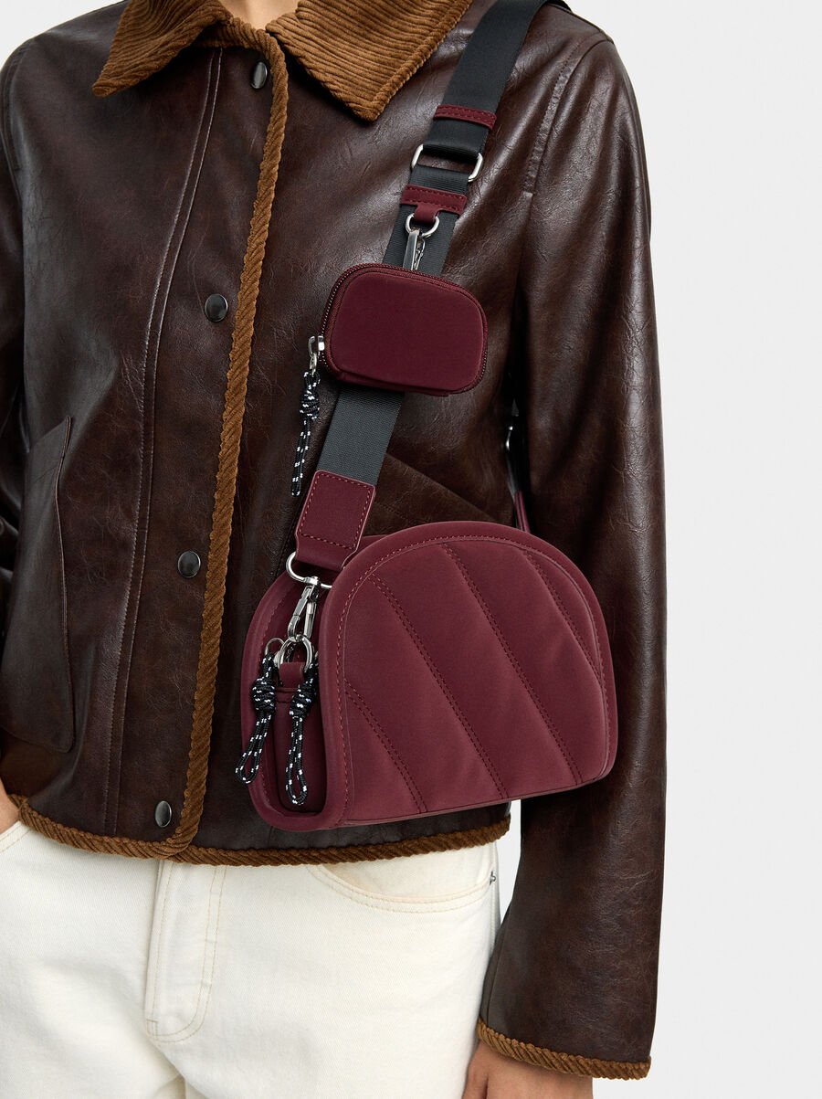 Crossbody bag with soft texture and pendant