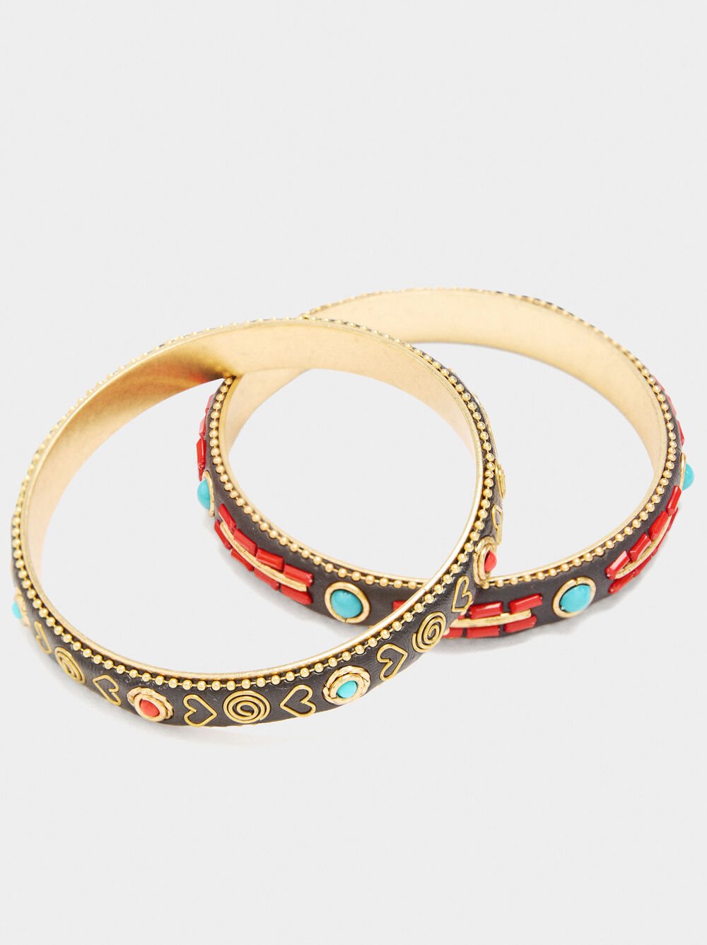Set of rigid bracelets with colour details