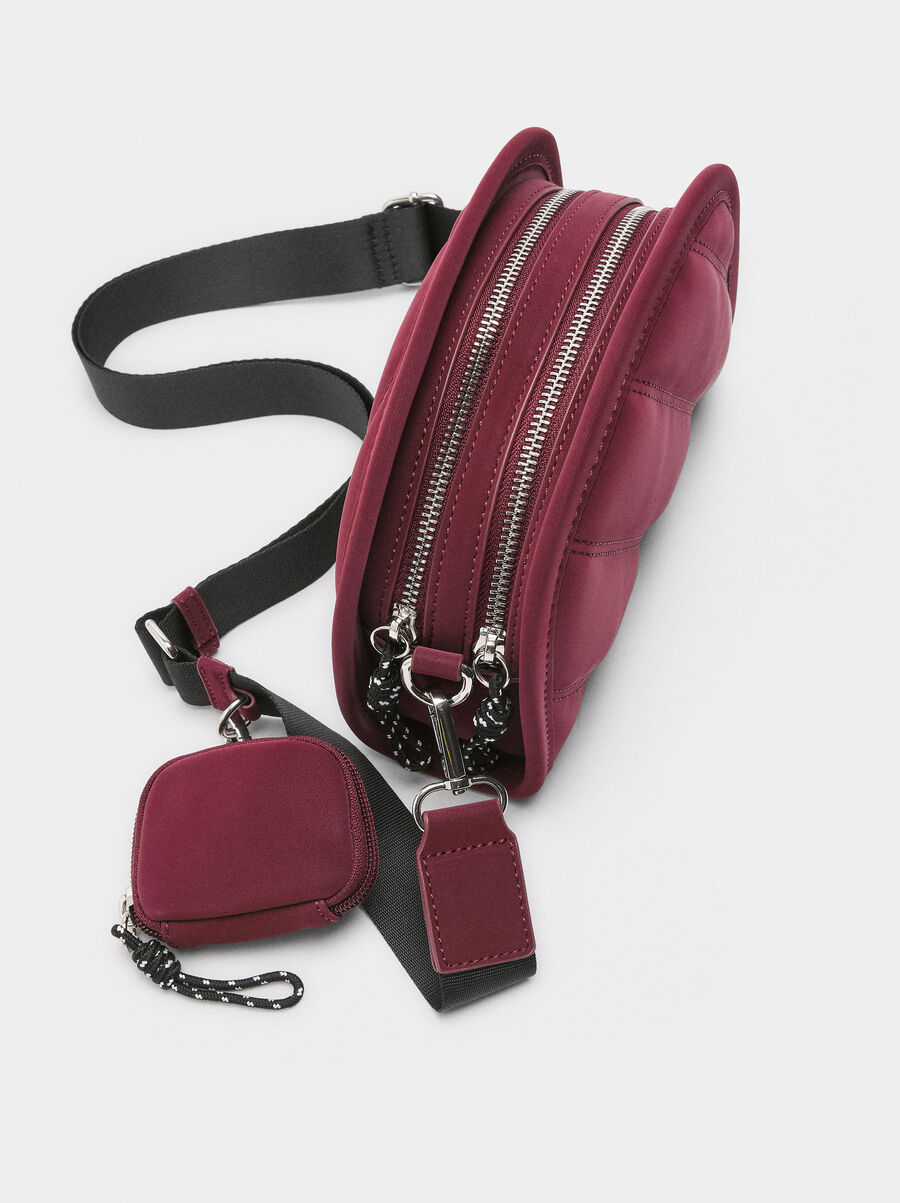 Crossbody bag with soft texture and pendant