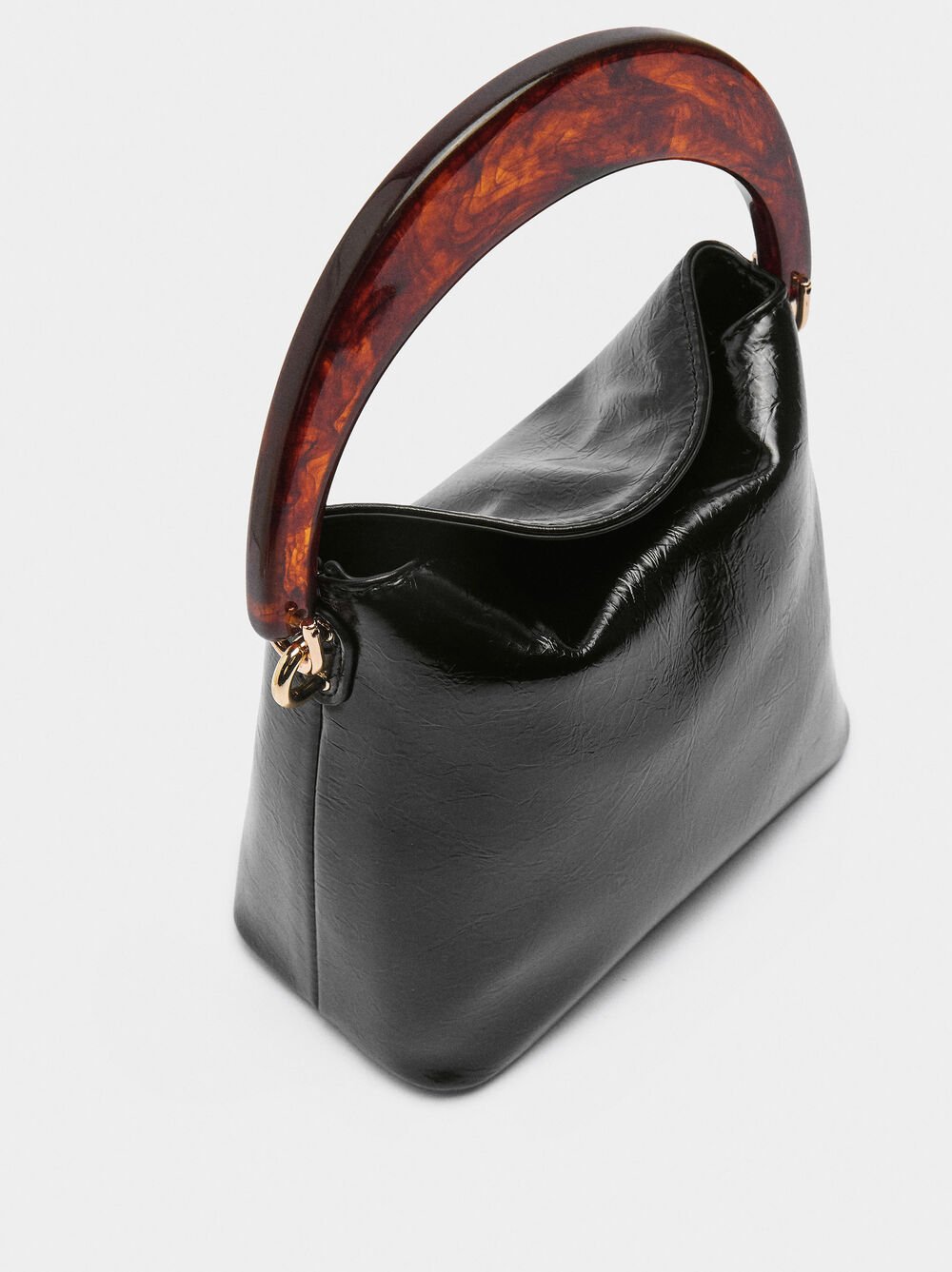 Handbag with tortoiseshell-effect handle