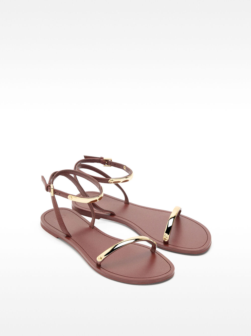 Flat sandals with metallic details