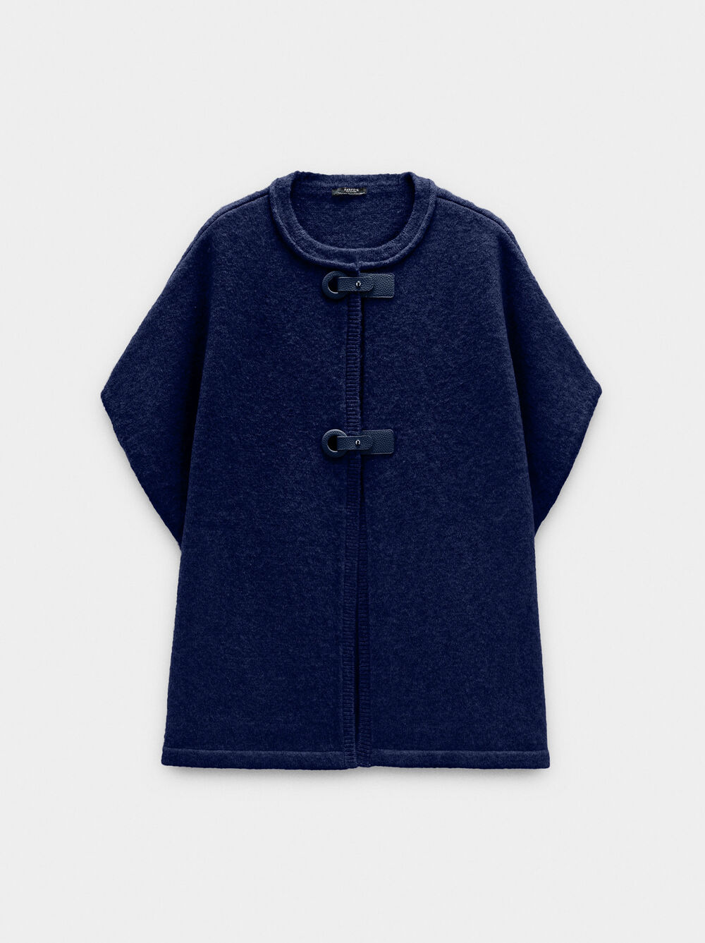 Poncho de malha com fivelas