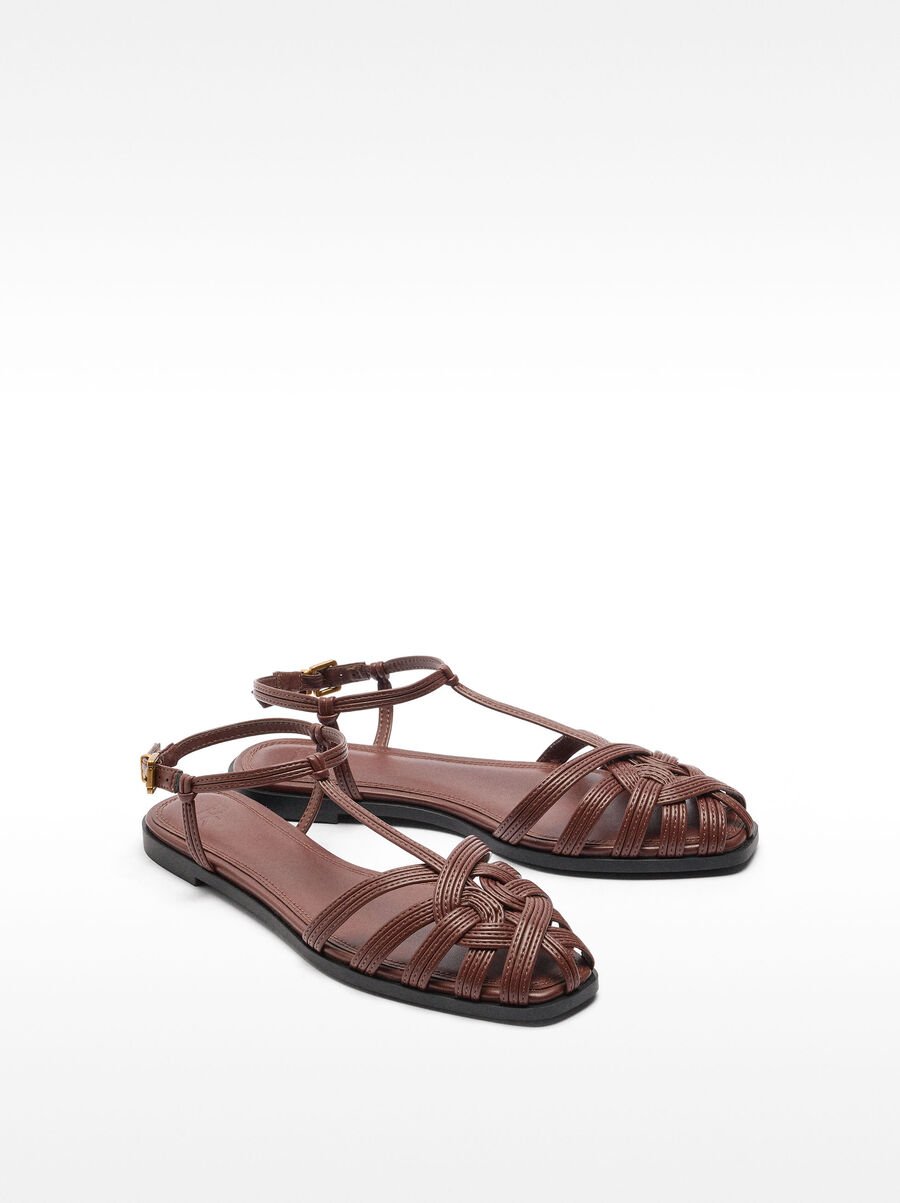 Flat sandals with braided straps