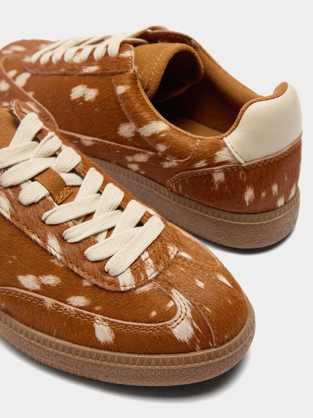 Leather sneakers with animal print