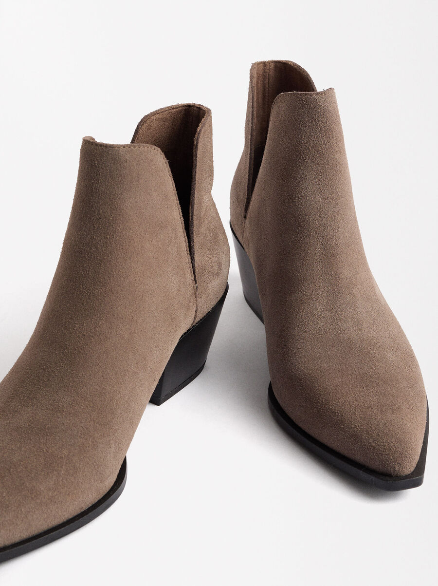 Leather cowboy ankle boots with openings