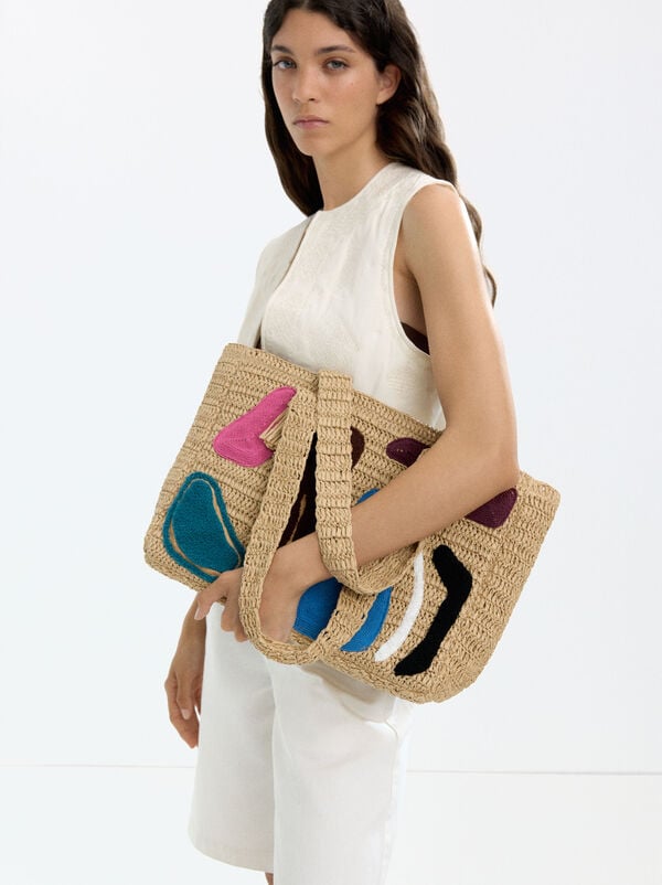 Shopper bag with straw effect and multicolor applications