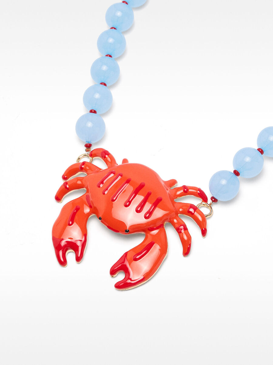 Collier de perles avec crabe