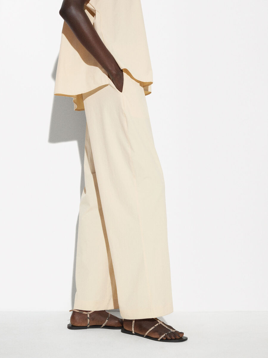 Trousers with elastic waistband