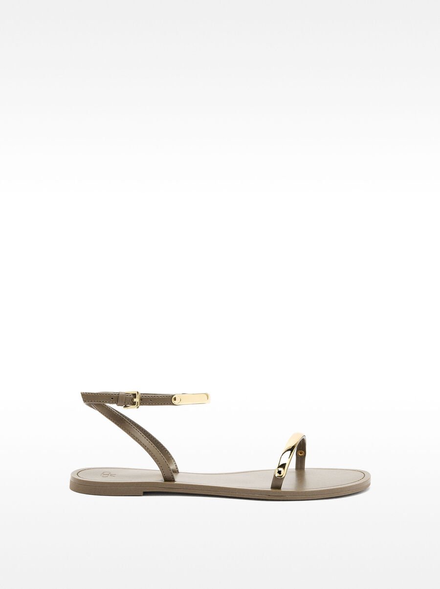 Flat sandals with metallic details