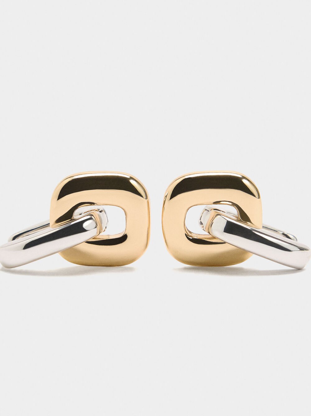 Crossed bicolor hoop earrings