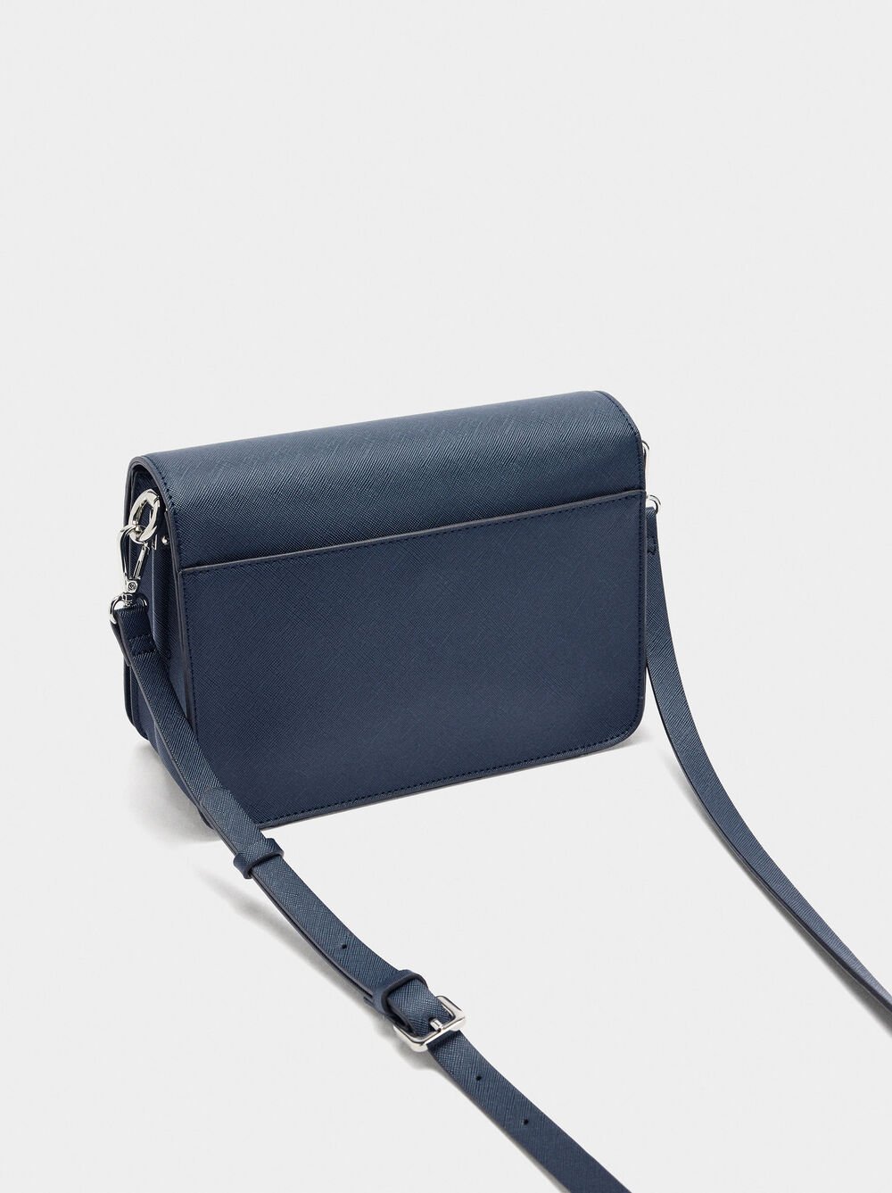 Crossbody bag with texture and flap closure