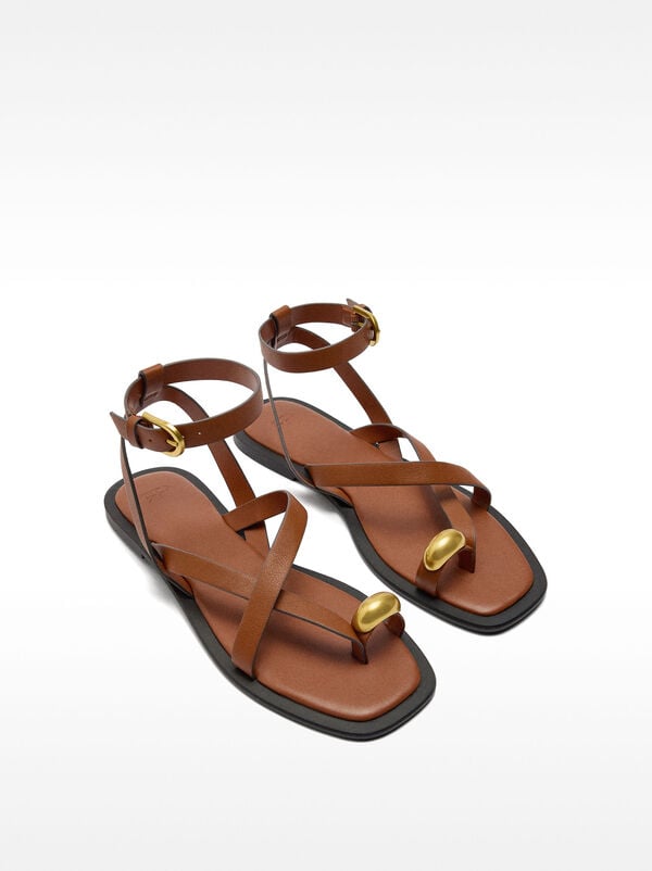 Leather sandals with metallic detail straps